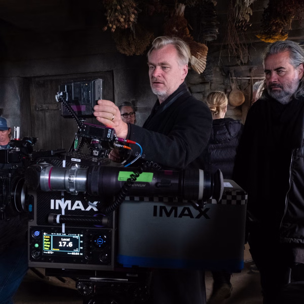 Christopher Nolan examining a large IMAX film camera on the set of The Odyssey.
Credit: Associated Press image hosted by The Independent