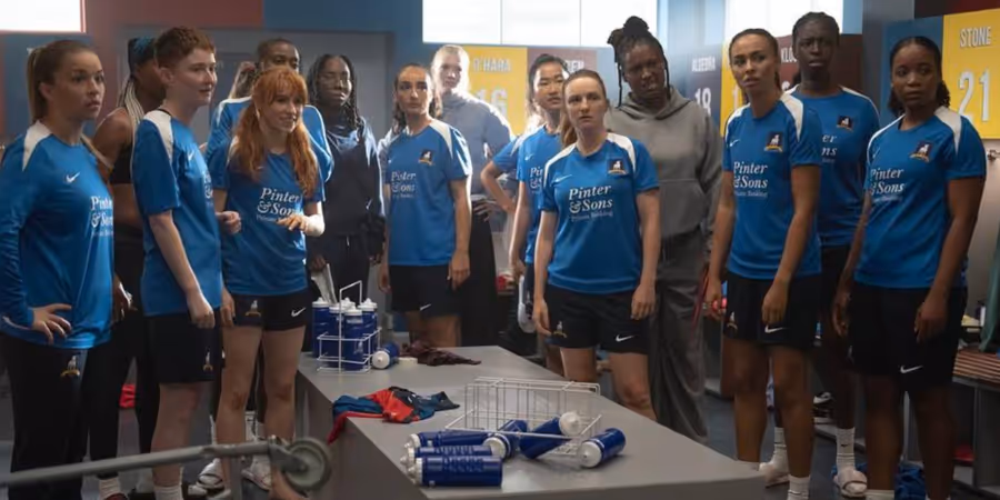AFC Richmond Lady Greyhounds players gathered in their locker room in Ted Lasso Season 4.