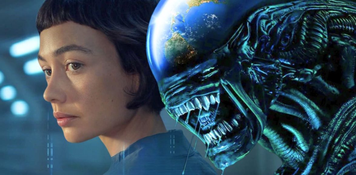 Wendy, played by Sydney Chandler, in the foreground of a blue-lit composition with a Xenomorph looming directly behind her.