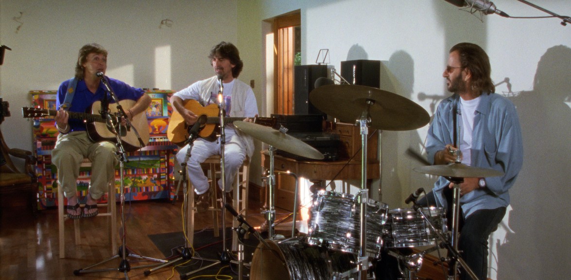 Archival photograph from the Beatles' 1990s Anthology reunion, used as the featured image for a review of the 2025 documentary.