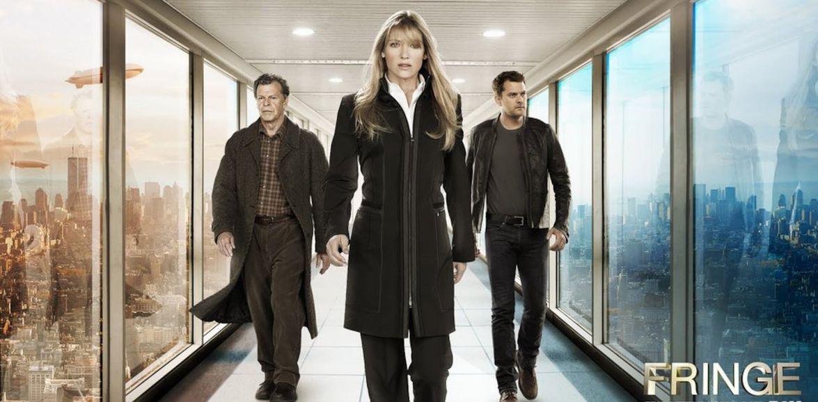 Olivia Dunham walking towards the camera through a bright glass corridor, flanked by Walter and Peter Bishop.