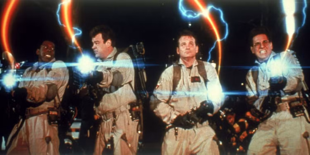 The Ghostbusters on the rooftop using their proton streams during the climax of the 1984 film.