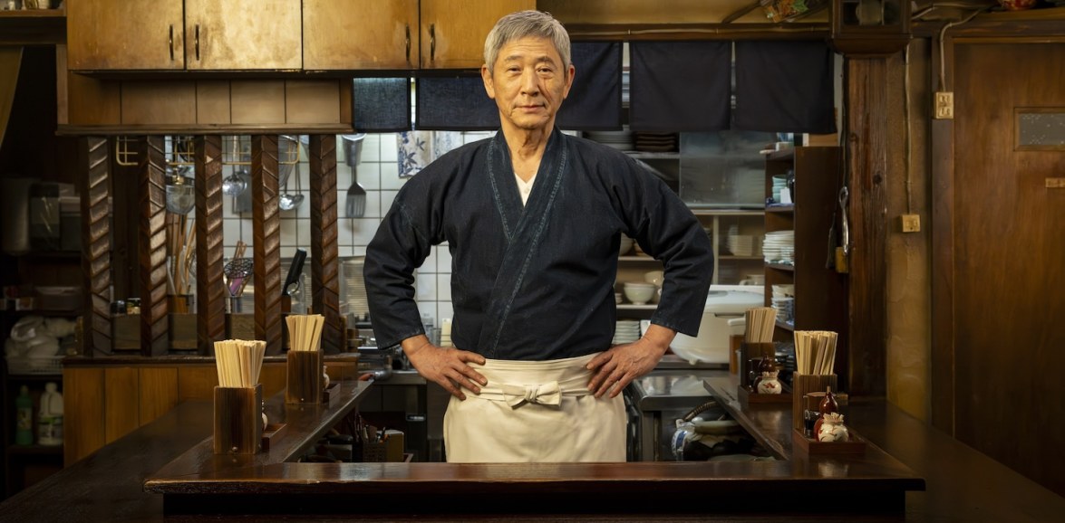 A visibly older Master stands in the compact Meshiya kitchen in Midnight Diner 6.