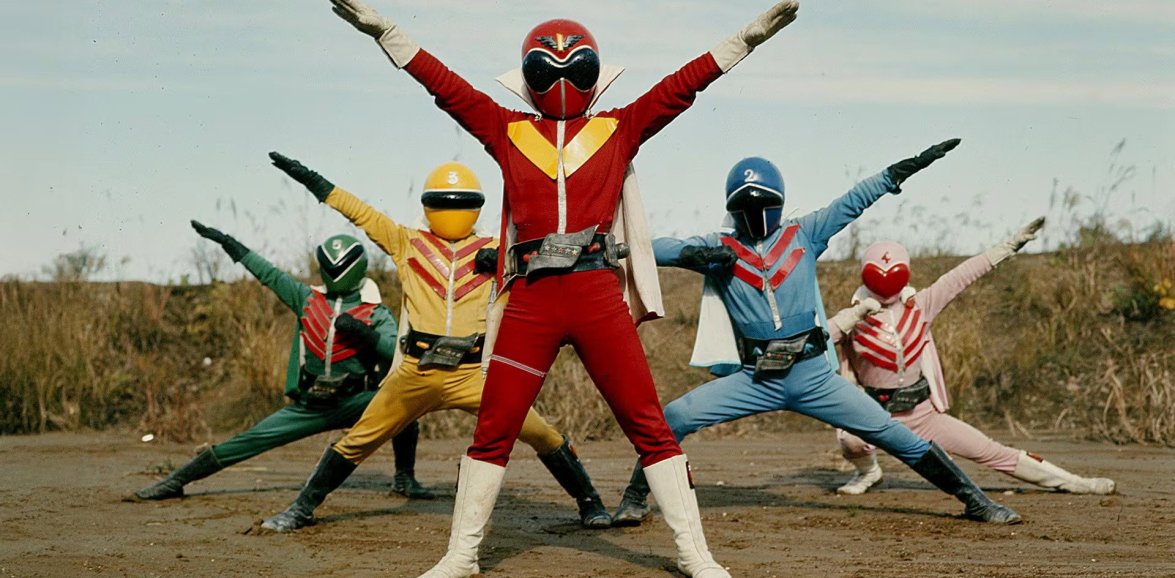 Five original 1975 Gorenger heroes wearing numbered red, blue, yellow, pink and green costumes.
